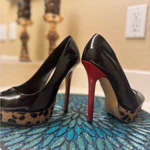 Elegant Black and Red High Heels with animal print platform